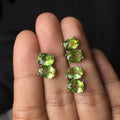 Natural grass green olivine 6x8mm elliptical stud earrings in sterling silver setting