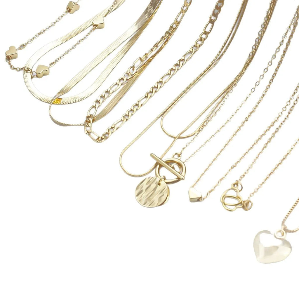 Gold electroplated women's necklace suit with ten pieces showing alloy pendants on snake bone chains