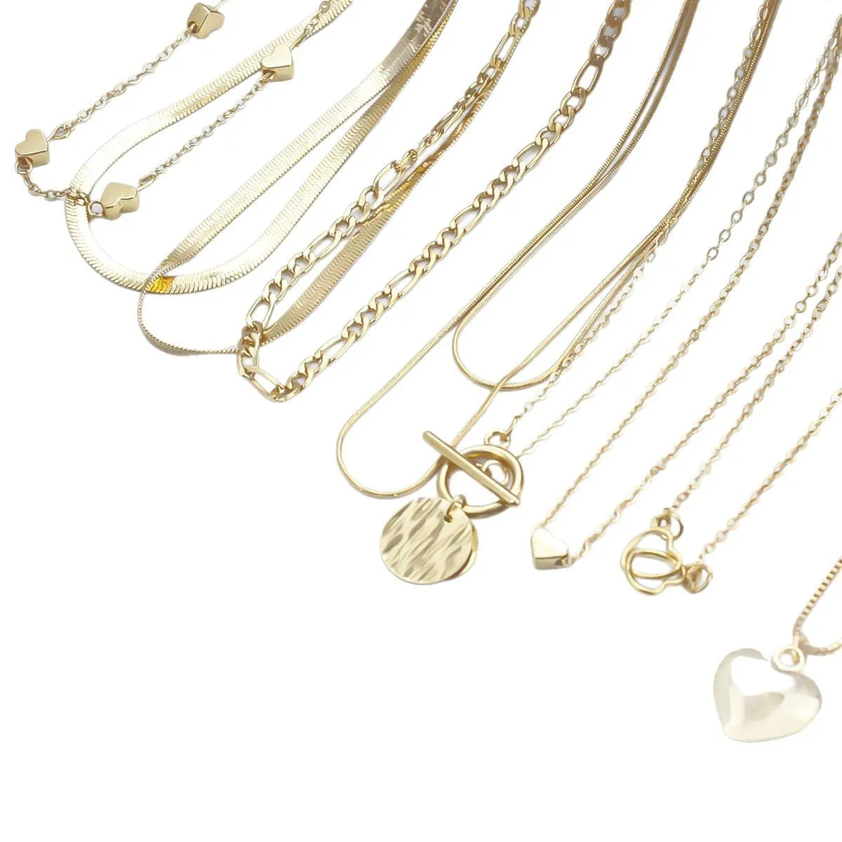 Gold electroplated women's necklace suit with ten pieces showing alloy pendants on snake bone chains