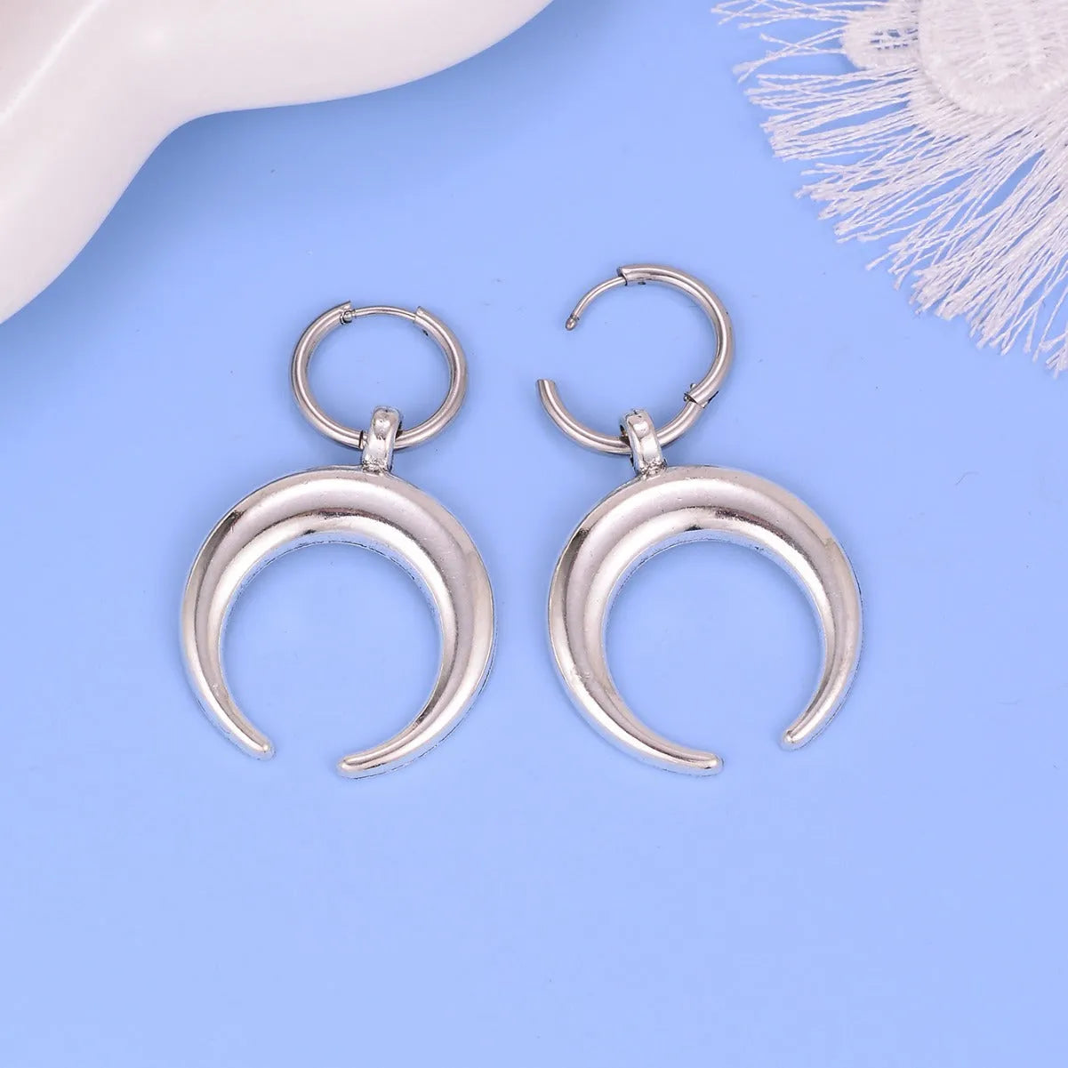 Silver geometric moon hoop earrings with punk gothic style and ear clip fastening