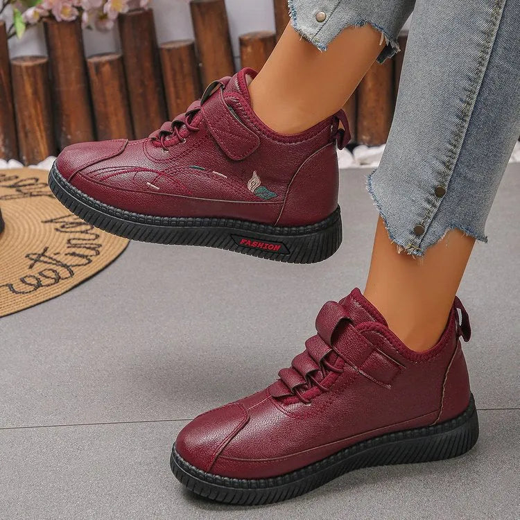 Black women's low-tube velvet cotton shoes with a hollow-out design and non-slip rubber sole.