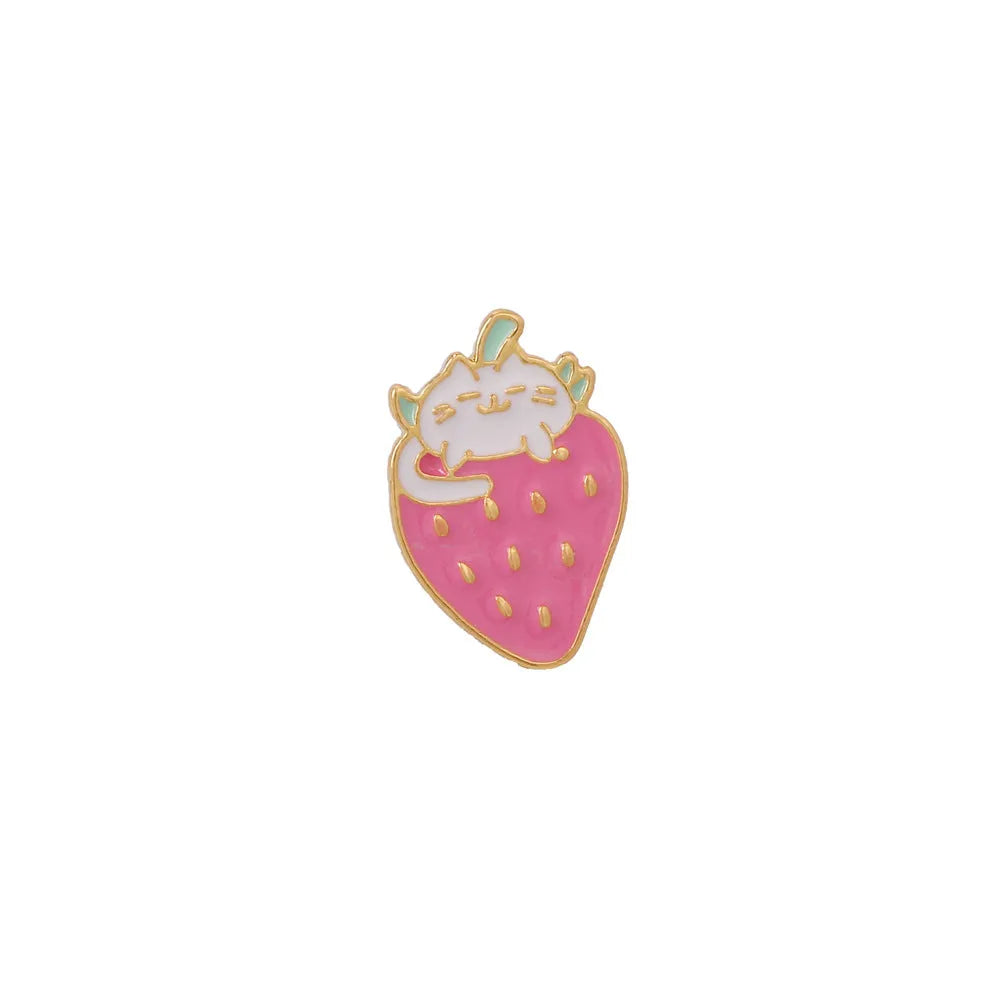 Close-up of a detailed alloy brooch showing a cute cat and strawberry in a dripping oil art style.