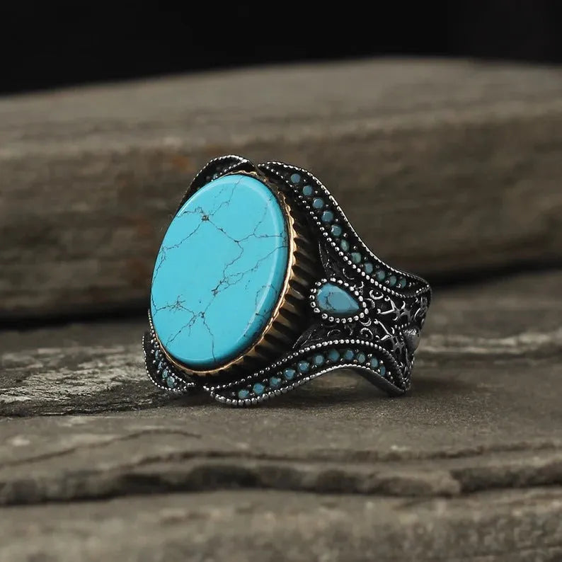 Men's antique silver alloy ring with turquoise colour on a round smooth band.