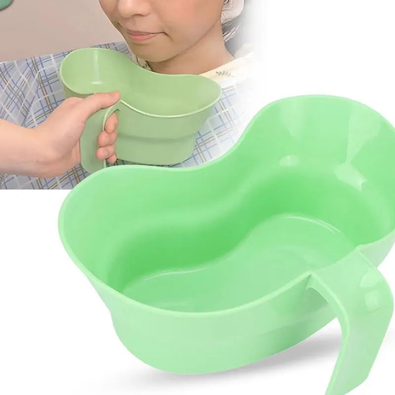 Green plastic gargle cup with spout for bedridden patient oral hygiene assistance
