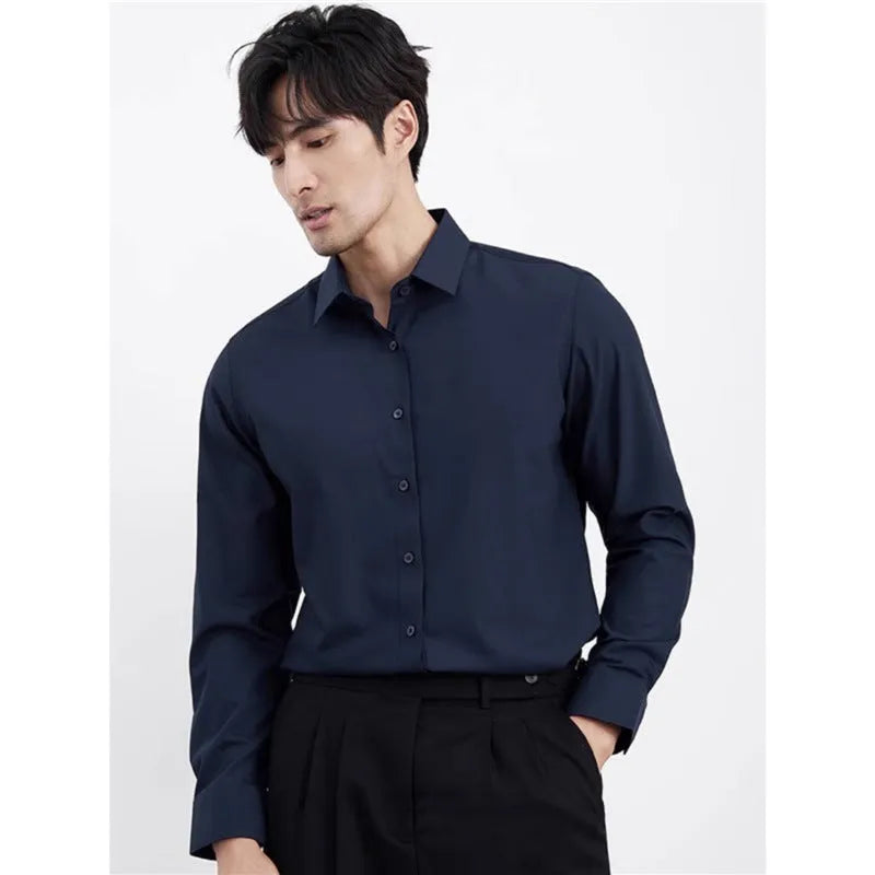 Man wearing a wine red slim fit long sleeve business casual shirt.