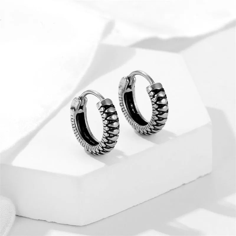 Silver geometric earrings with circular striped design in titanium steel