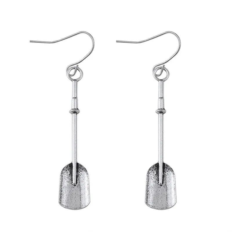 Long geometric shovel-shaped earrings with ancient silver finish and ethnic styling