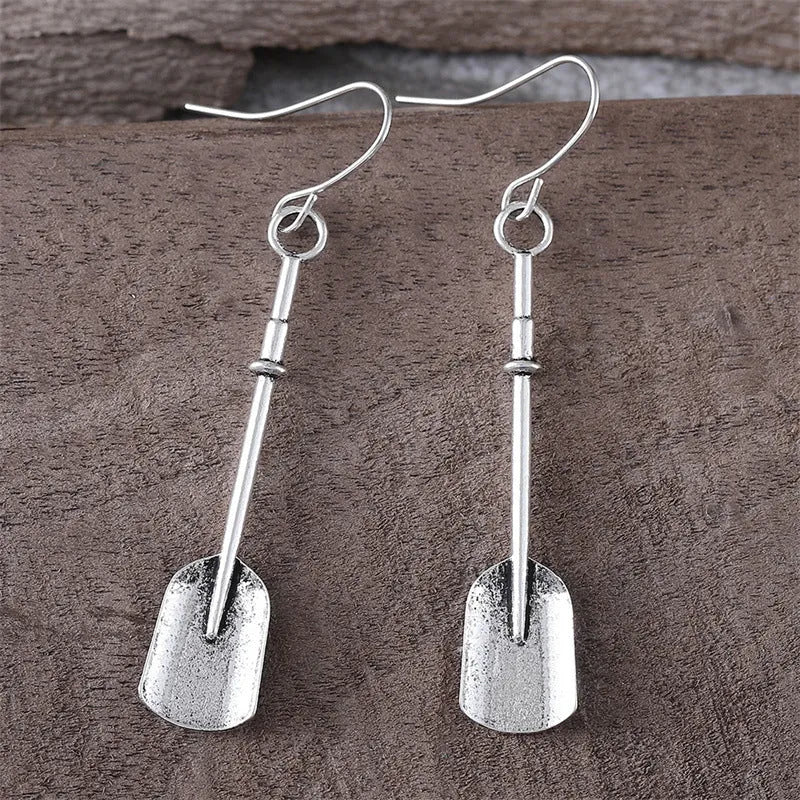 Long geometric shovel-shaped earrings with ancient silver finish and ethnic styling