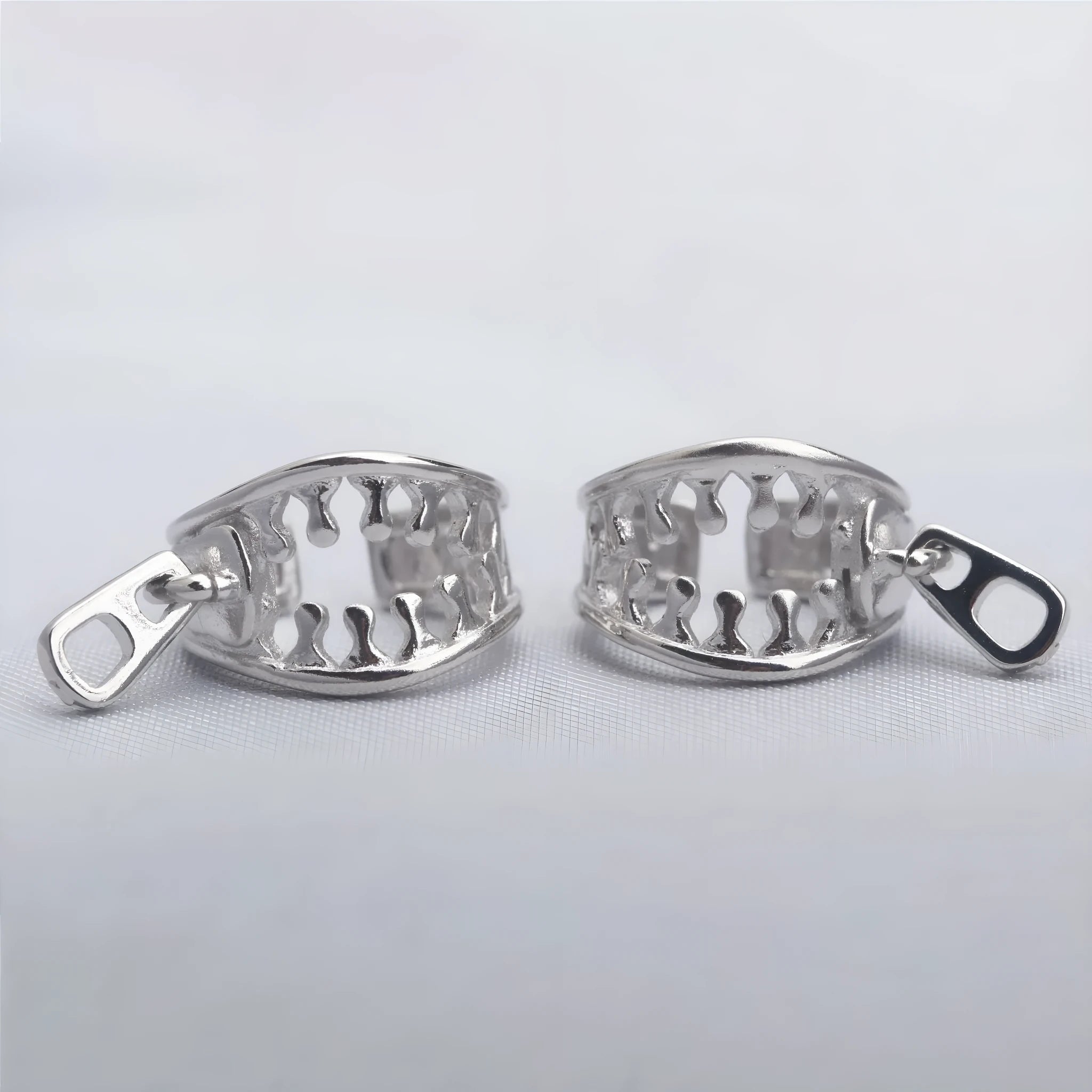 Copper geometric clip-on earrings with linear design elements in colour ES862