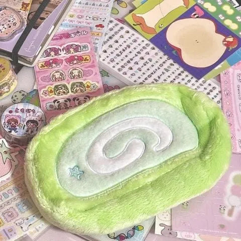 Honeydew roll plush velvet pencil case with Swiss roll cake design and zipped closure
