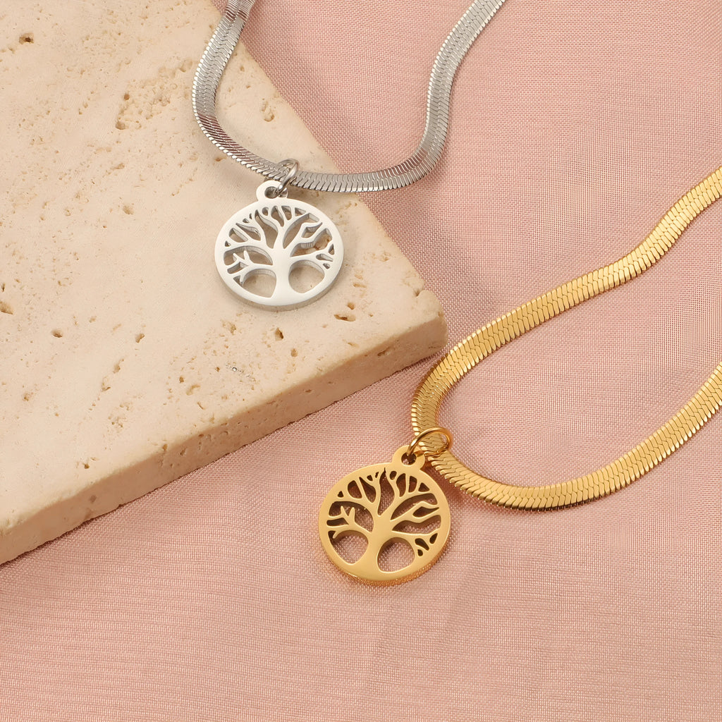 Stainless steel necklace with tree pendant on an adjustable snake bone chain in gold colour.