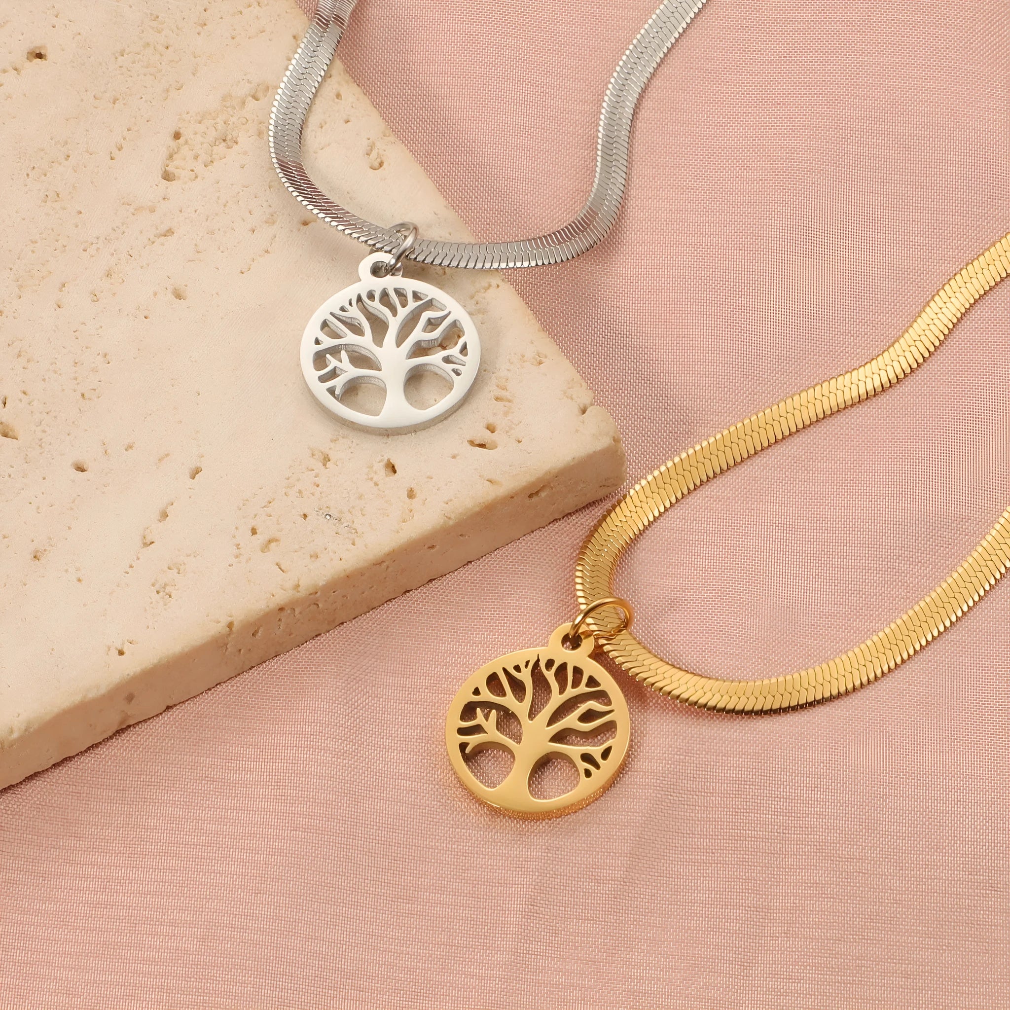 Stainless steel necklace with tree pendant on an adjustable snake bone chain in gold colour.