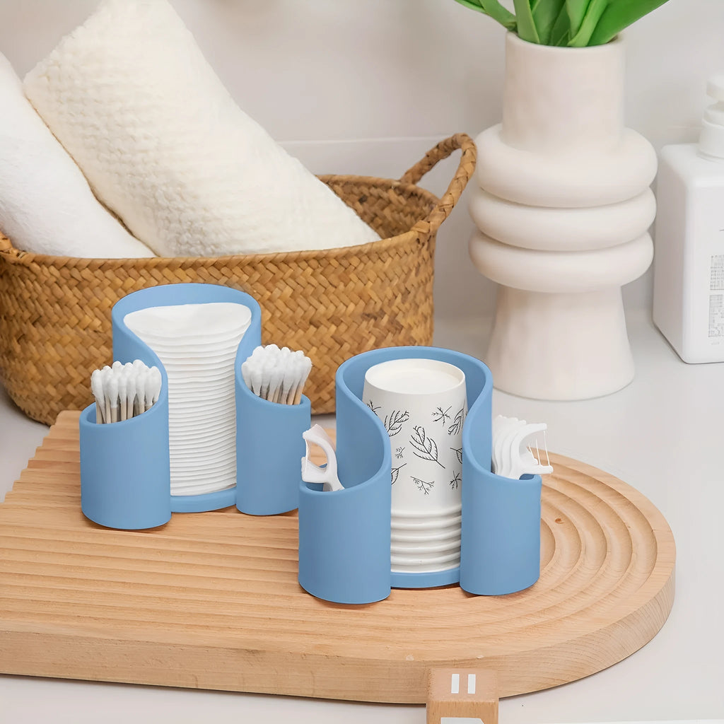 Solid colour plastic dental floss storage box with integrated cotton swab holder.