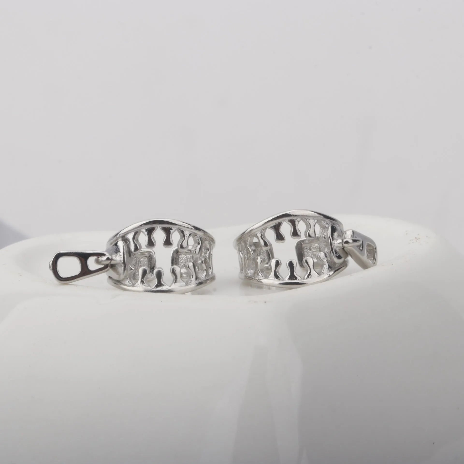 Copper geometric clip-on earrings with linear design elements in colour ES862
