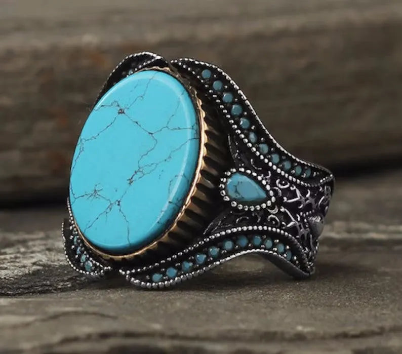 Men's antique silver alloy ring with turquoise colour on a round smooth band.