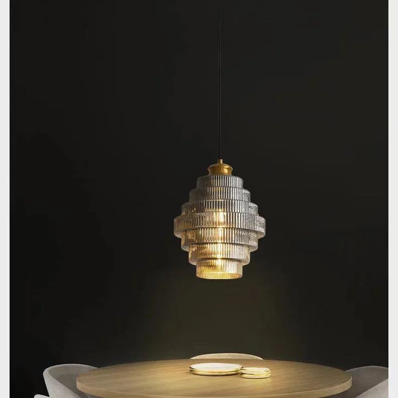 Modern simple pendant drop light in smoked grey or amber glass for hallway or bedroom.