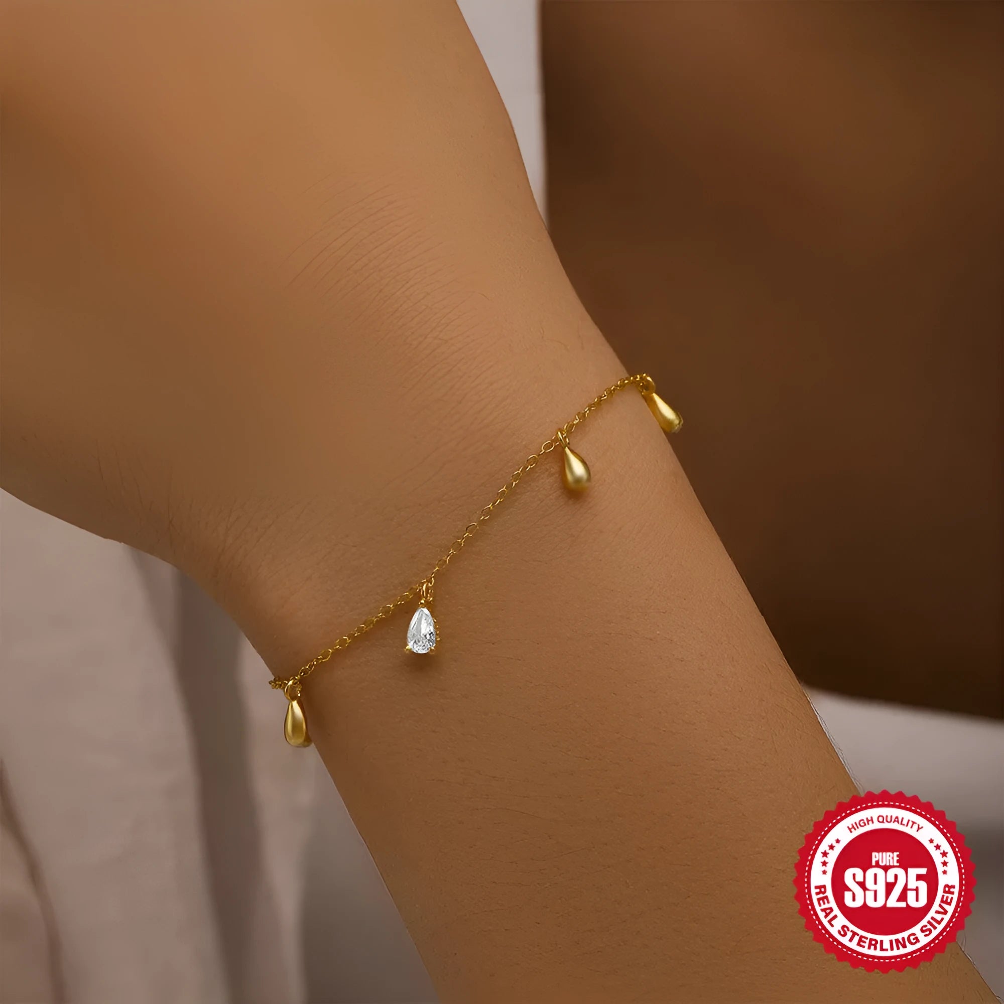 S925 sterling silver bracelet with geometric water drop pendant and diamond accents in gold colour
