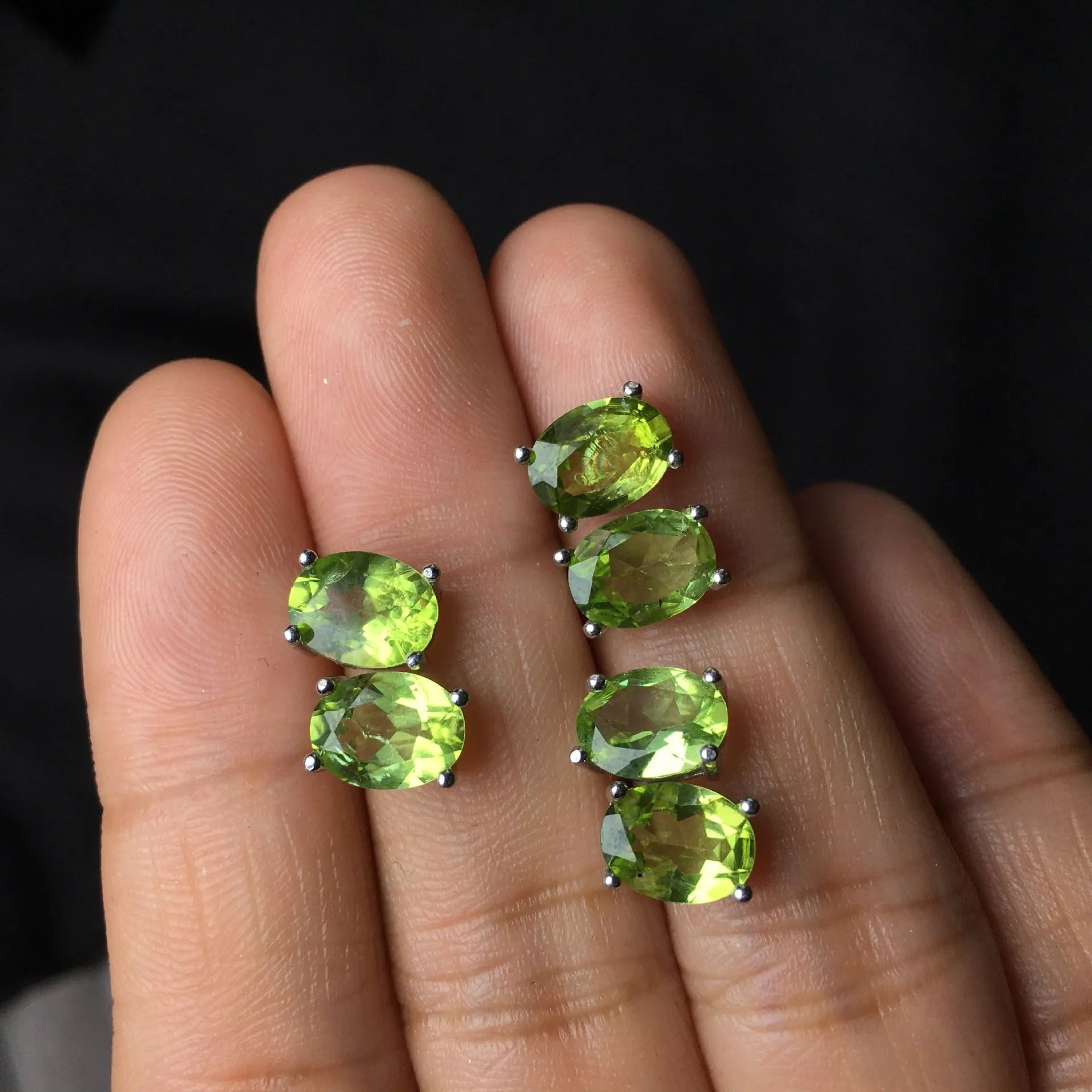 Natural grass green olivine 6x8mm elliptical stud earrings in sterling silver setting