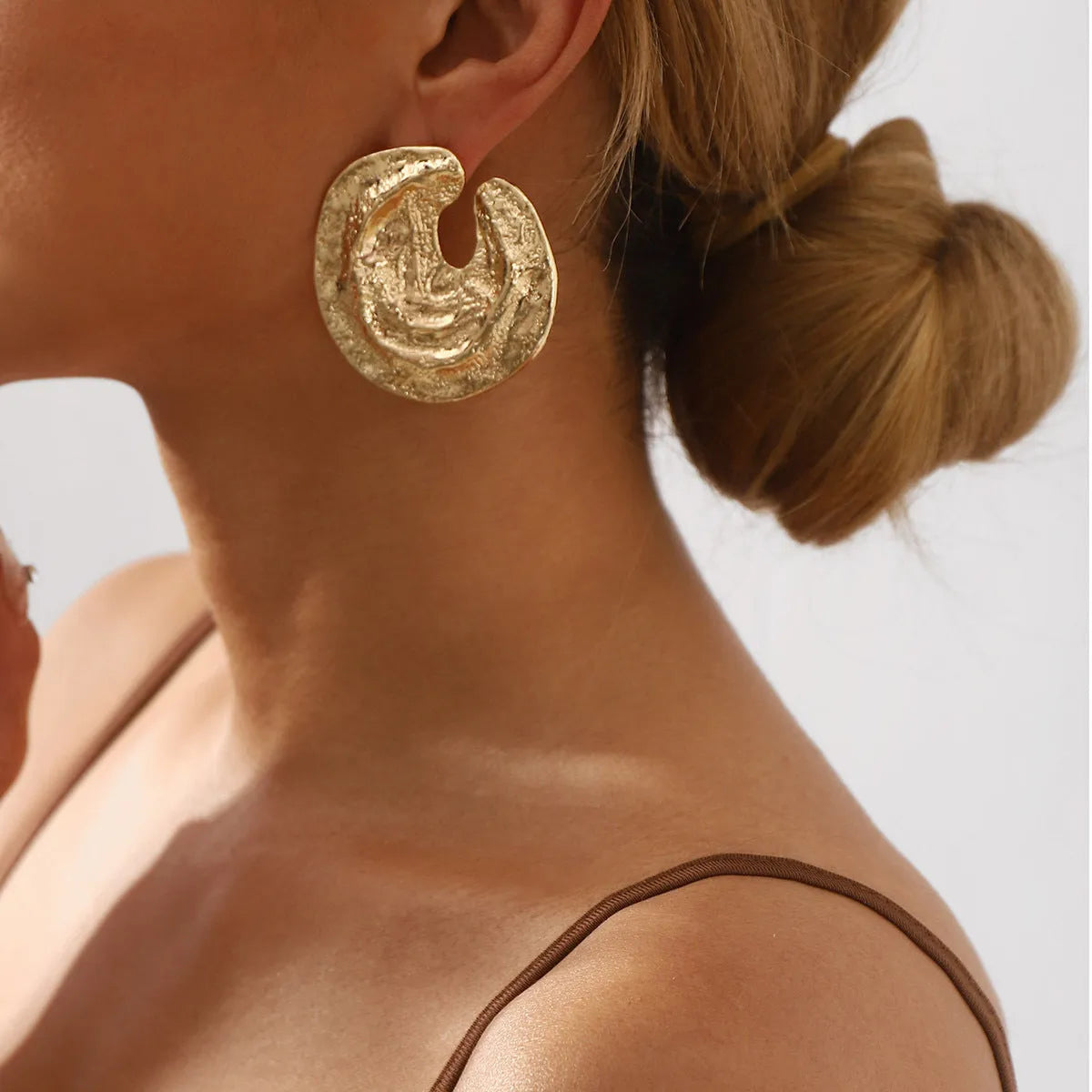 Exaggerated irregular pleated women's earrings with geometric cold concave-convex texture in gold colour