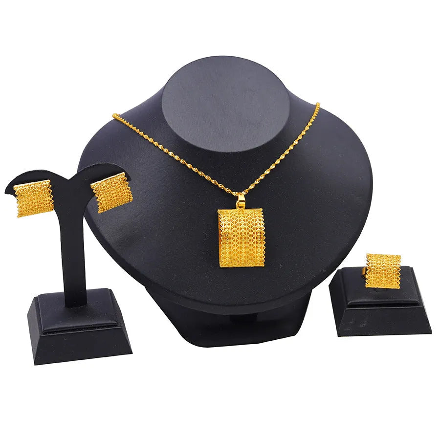 Gold-coloured copper bridal jewellery set with necklace, earrings, and ring in natural style
