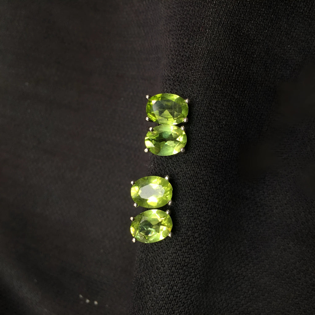 Natural grass green olivine 6x8mm elliptical stud earrings in sterling silver setting