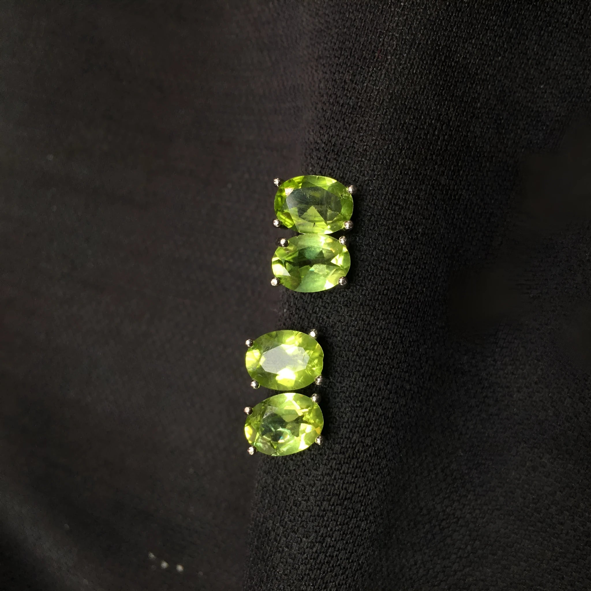 Natural grass green olivine 6x8mm elliptical stud earrings in sterling silver setting