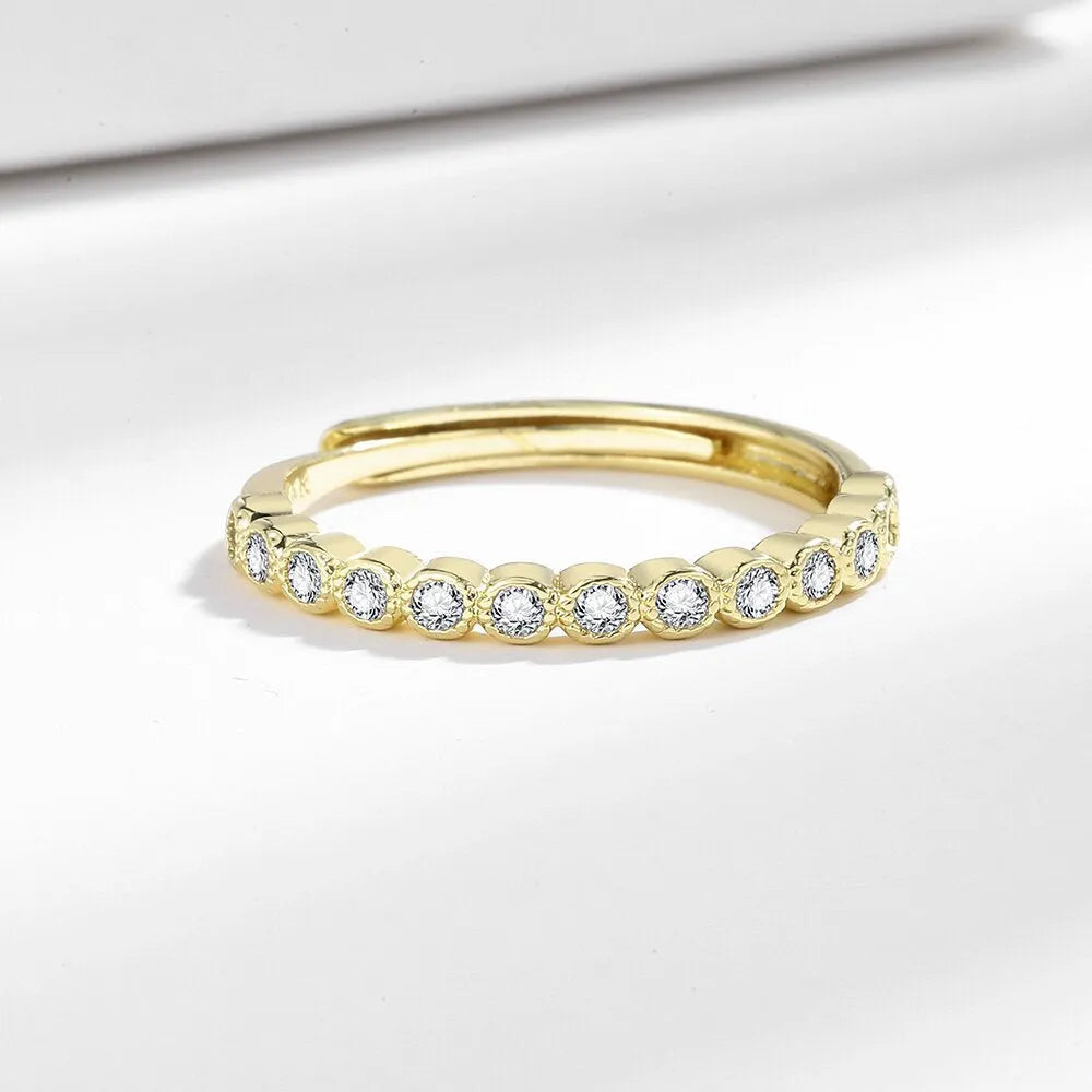 Women's geometric open ring with a diamond tail detail in a white gold or yellow gold colour finish.