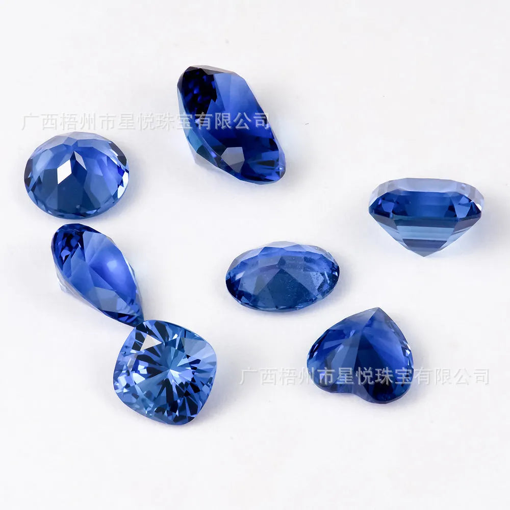 Royal blue heart shaped tiara gemstone jewellery component on white background.