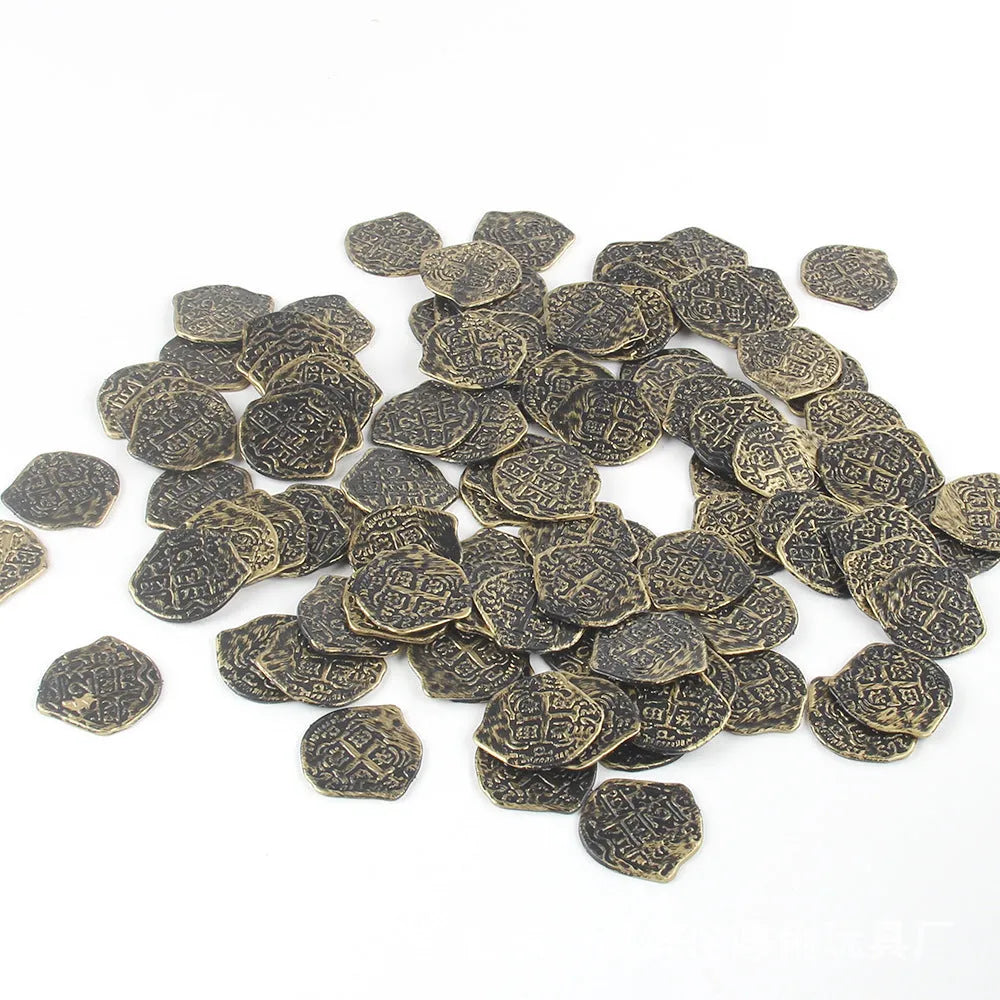 A pile of replica Roman coins in bronze, gold, and silver metallic finishes.