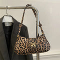 Women's casual PU leather handbag with sandwich pocket design in black, brown, coffee, or khaki colours
