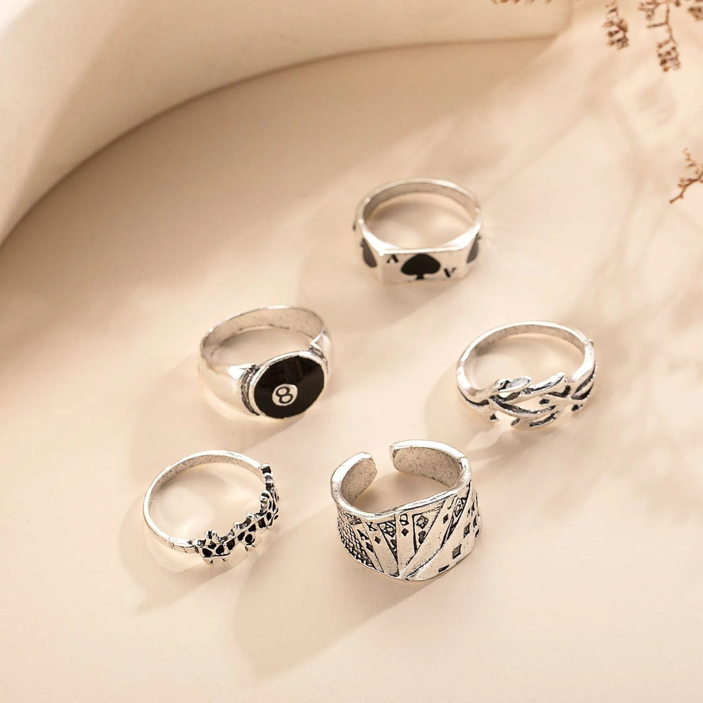 Black alloy poker ring with raised spade card design on adjustable band