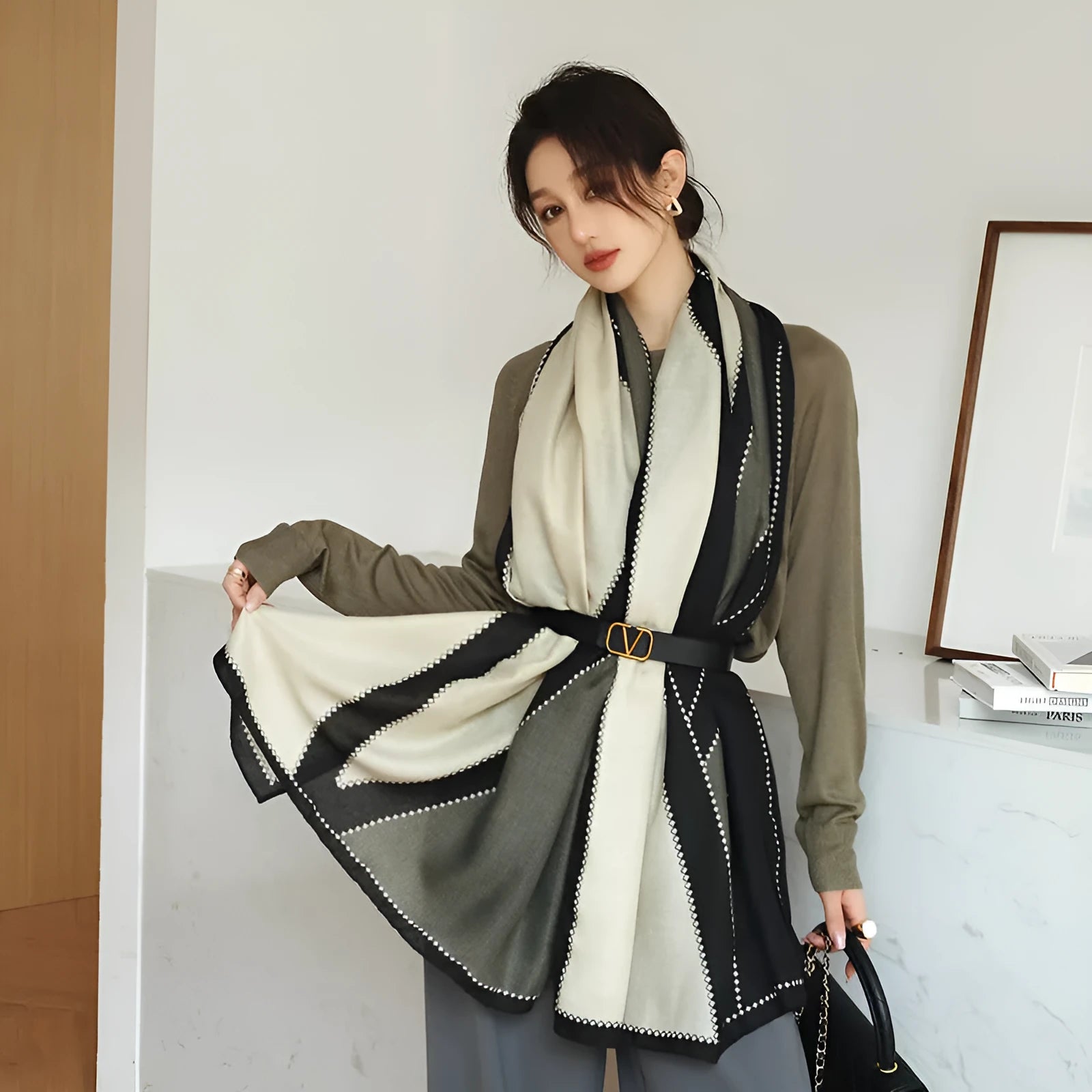 A woman wearing a printed polyester shawl, showcasing one of three available elegant styles, with dimensions of 180cm by 90cm.