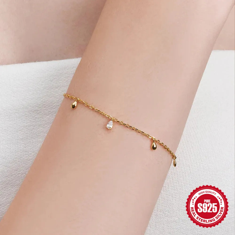 S925 sterling silver bracelet with geometric water drop pendant and diamond accents in gold colour