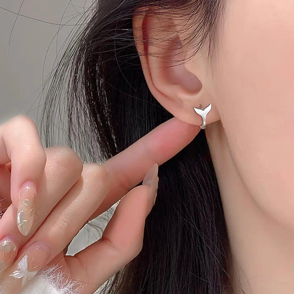 Women's copper fishtail earrings with electroplated white or yellow gold finish