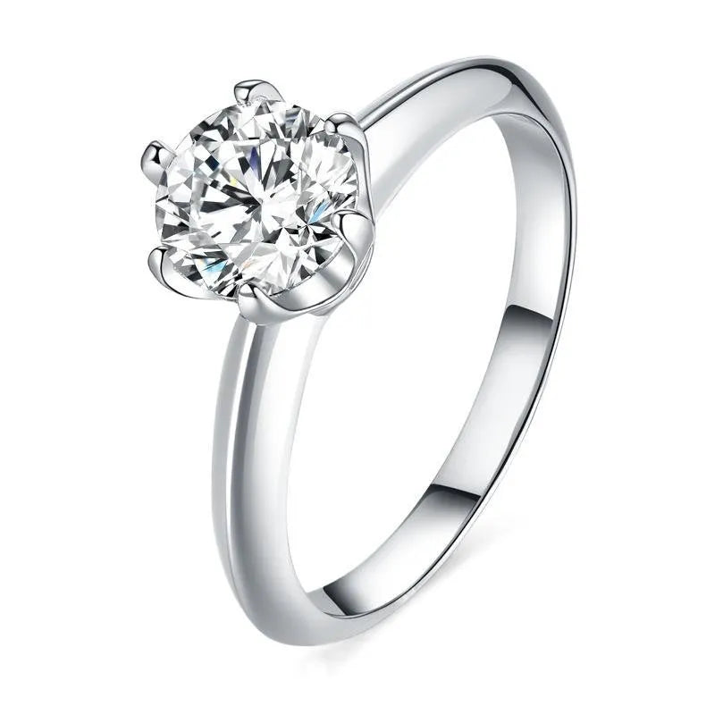 A pair of silver-plated adjustable couple rings with dragon, phoenix, and heart decorations, set with D colour moissanite stones.