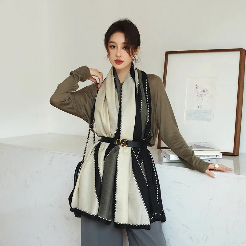 A woman wearing a printed polyester shawl, showcasing one of three available elegant styles, with dimensions of 180cm by 90cm.