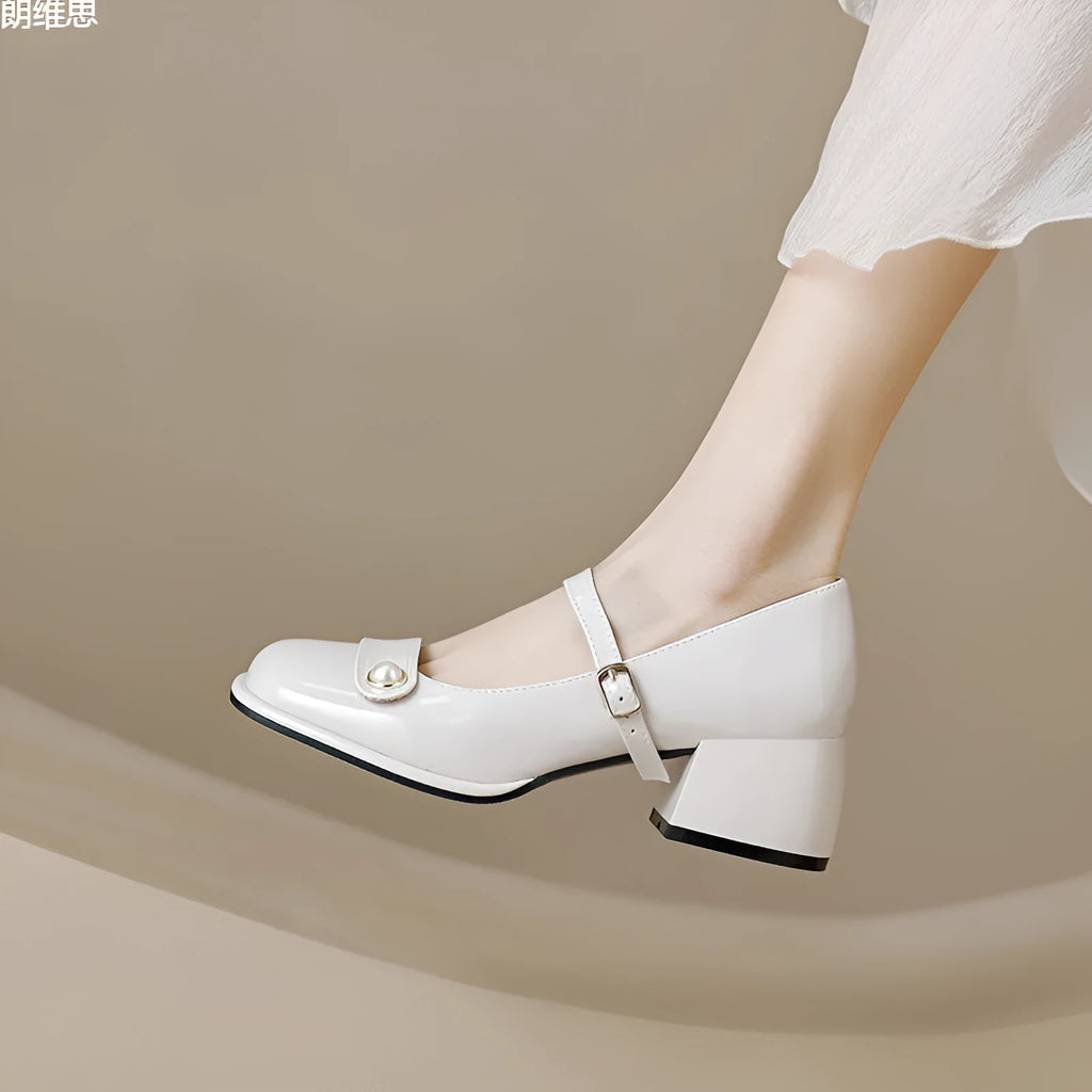 French style chunky heel pump shoes with buckle closure in patent leather, showing square toe design.