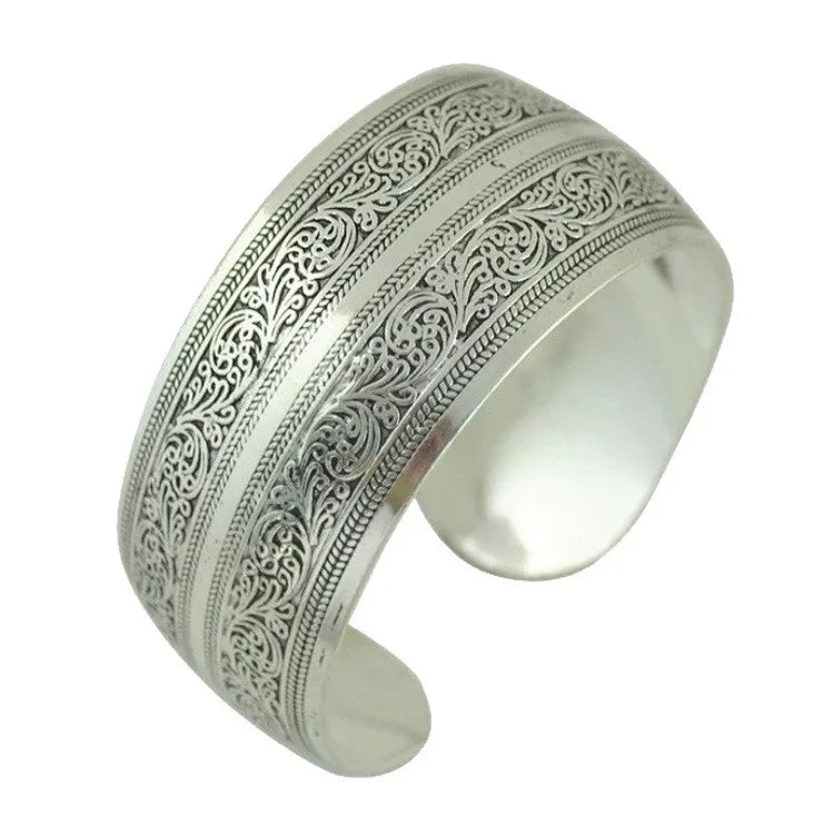 Miao-inspired ethnic bracelet with carved open design in elephant colour Roman shape