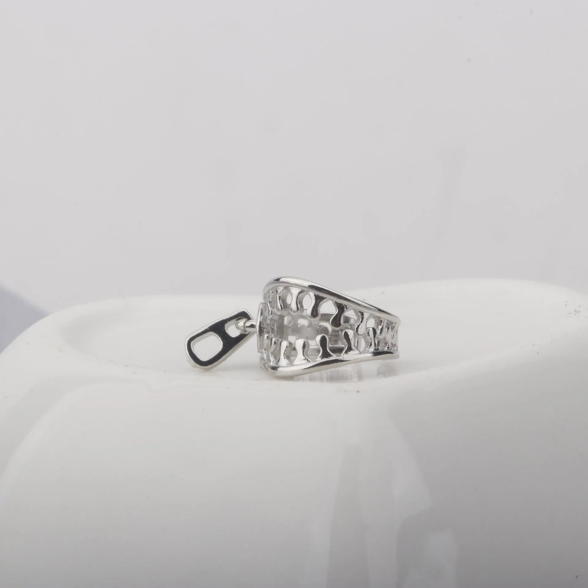 Copper geometric clip-on earrings with linear design elements in colour ES862