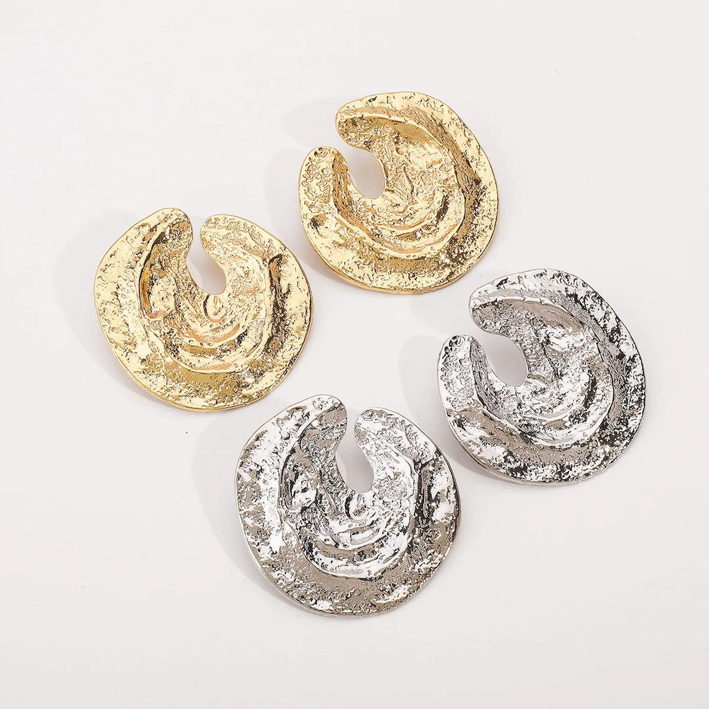 Exaggerated irregular pleated women's earrings with geometric cold concave-convex texture in gold colour