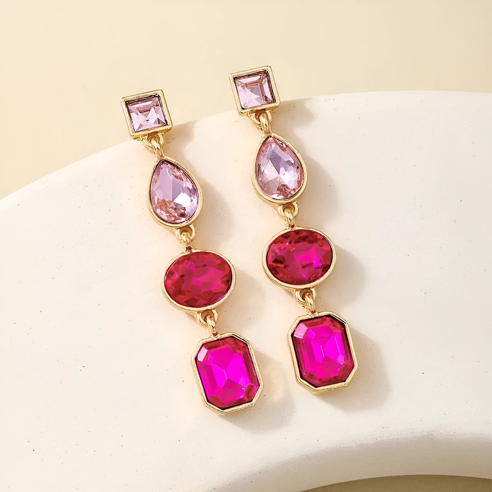 Pair of alloy geometric water drop stud earrings for women in rose red colour