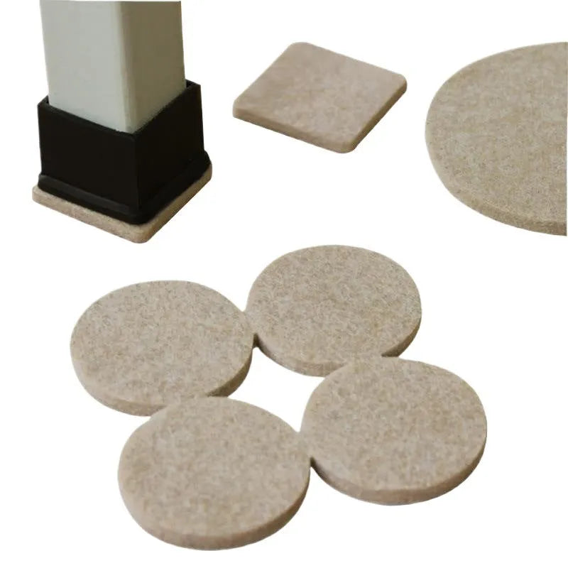 Beige plastic furniture protection foot pads in five different sizes on a wooden floor.
