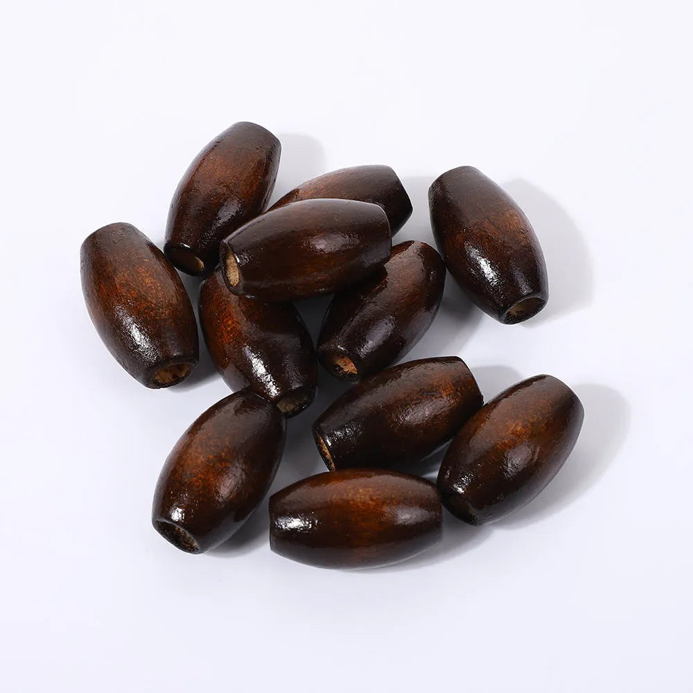 Dark coffee coloured oval wooden beads with M-shaped raised surface design