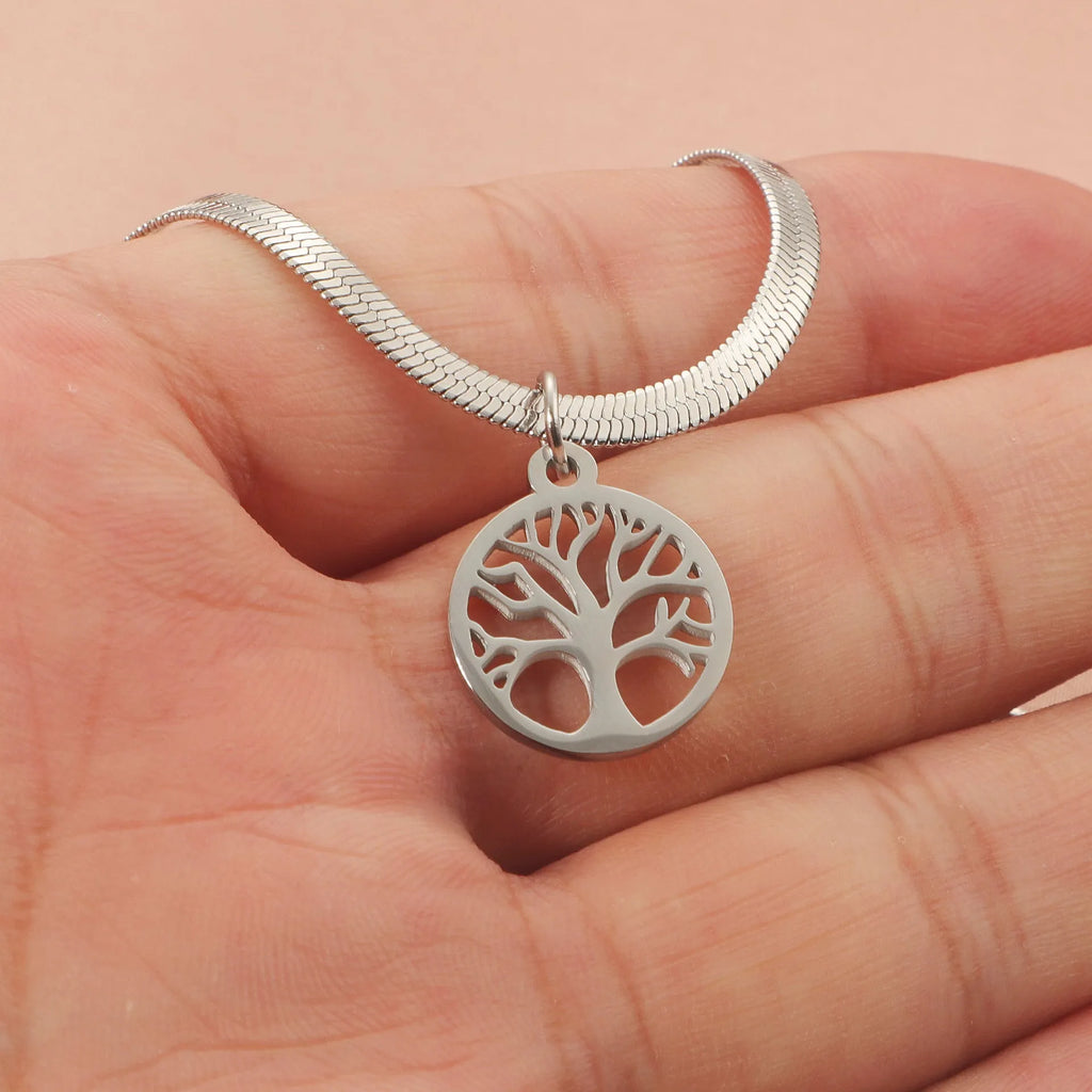 Stainless steel necklace with tree pendant on an adjustable snake bone chain in gold colour.