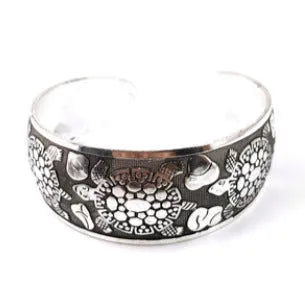 Miao-inspired ethnic bracelet with carved open design in elephant colour Roman shape