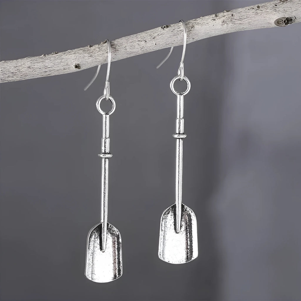 Long geometric shovel-shaped earrings with ancient silver finish and ethnic styling