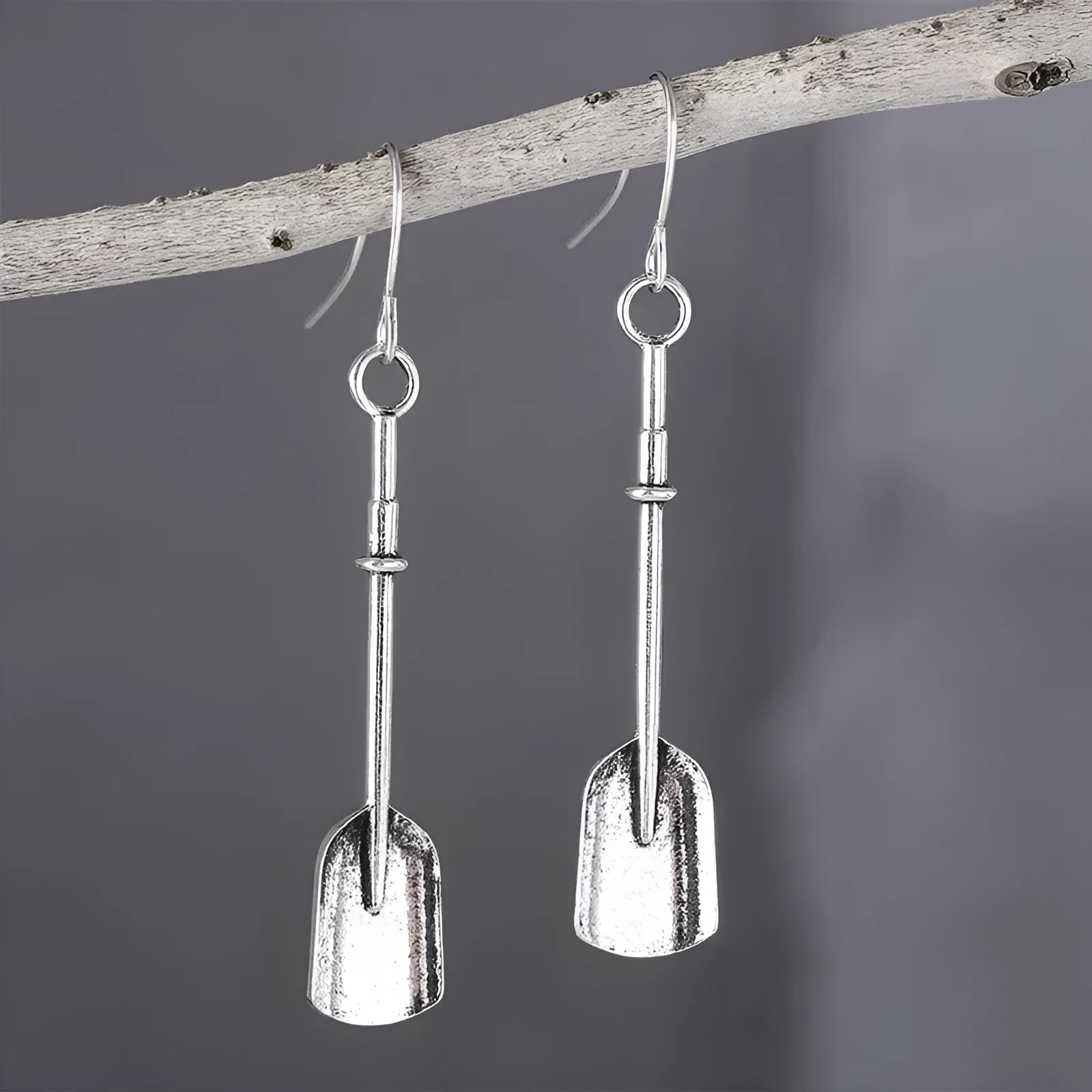 Long geometric shovel-shaped earrings with ancient silver finish and ethnic styling