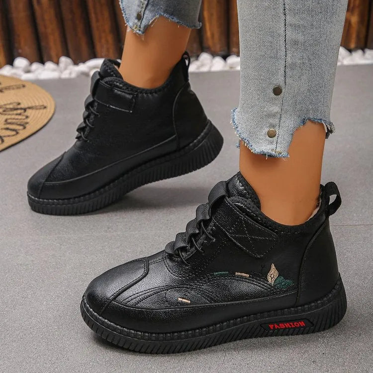 Black women's low-tube velvet cotton shoes with a hollow-out design and non-slip rubber sole.
