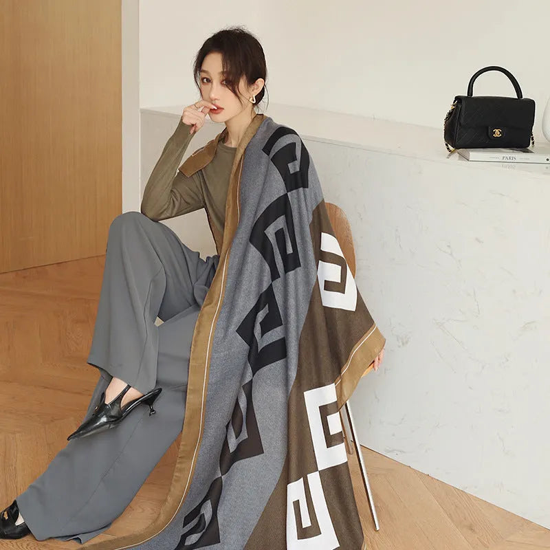 A woman wearing a printed polyester shawl, showcasing one of three available elegant styles, with dimensions of 180cm by 90cm.