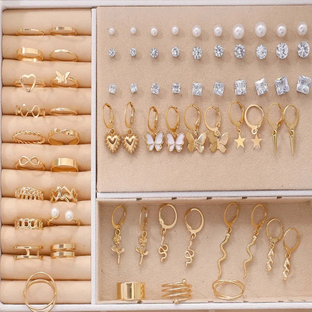 108 geometric pearl earrings with round elements and gold electroplated finish displayed as bulk set